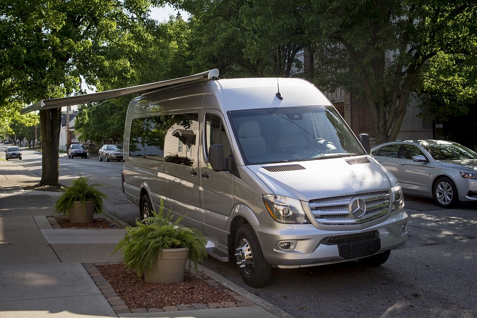 Silver van with an open awning
