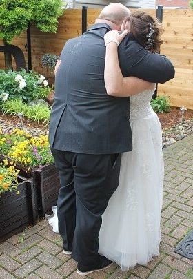 Man and woman embracing in a garden